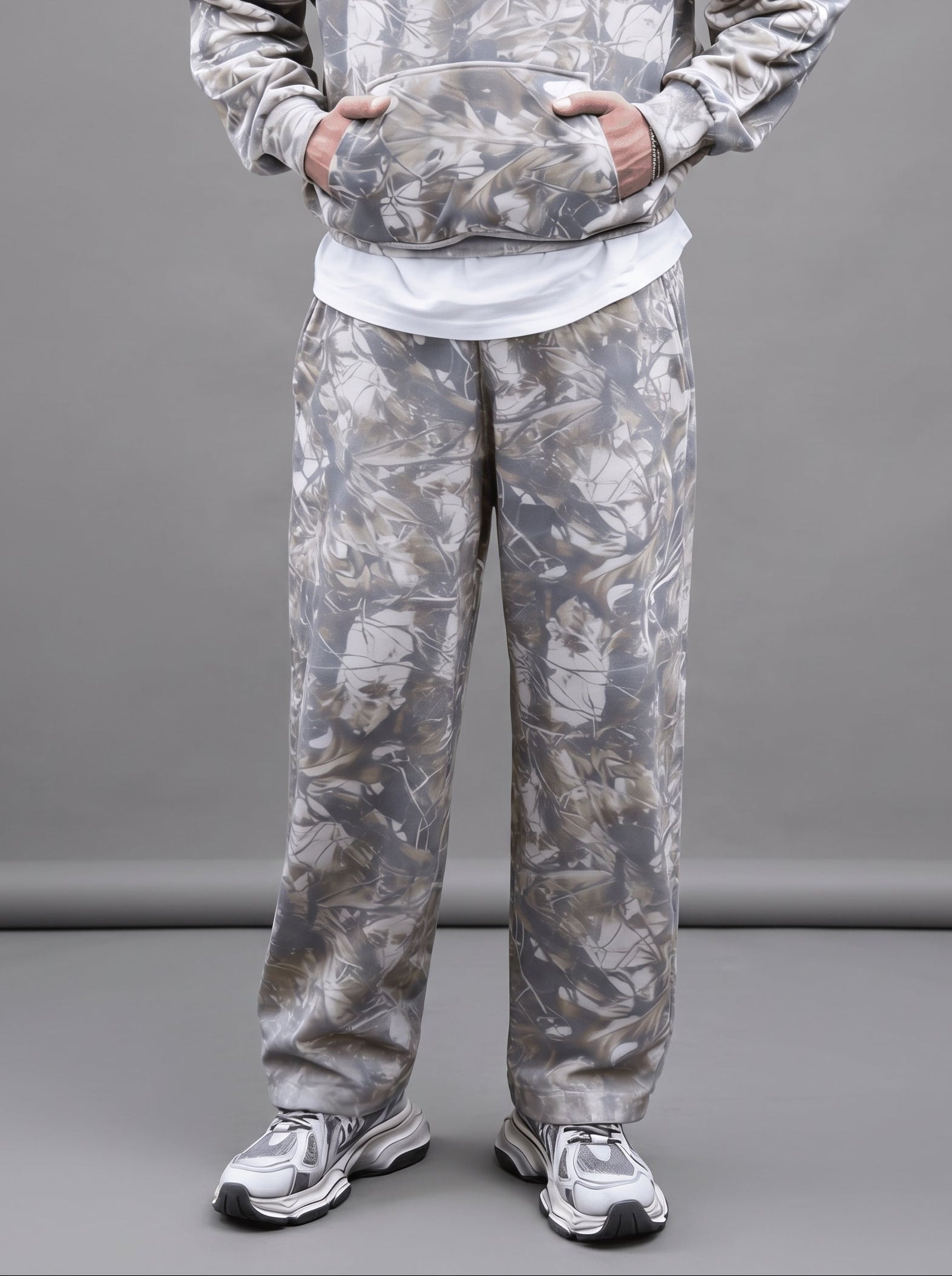 Unisex oversized heavyweight French Terry sweatpants in botanical grey camo with an open-hem straight leg fit