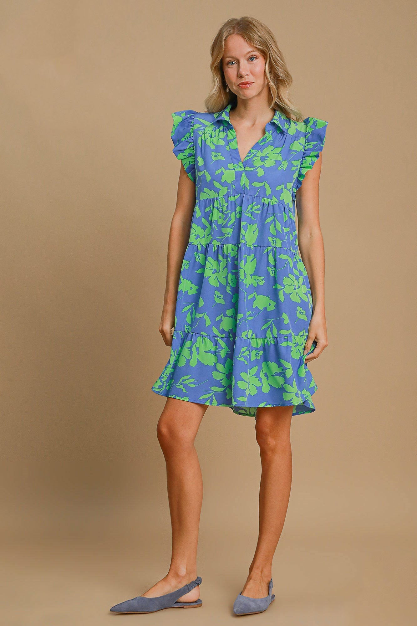 Blue and bright green floral print dress with ruffle cap sleeves.