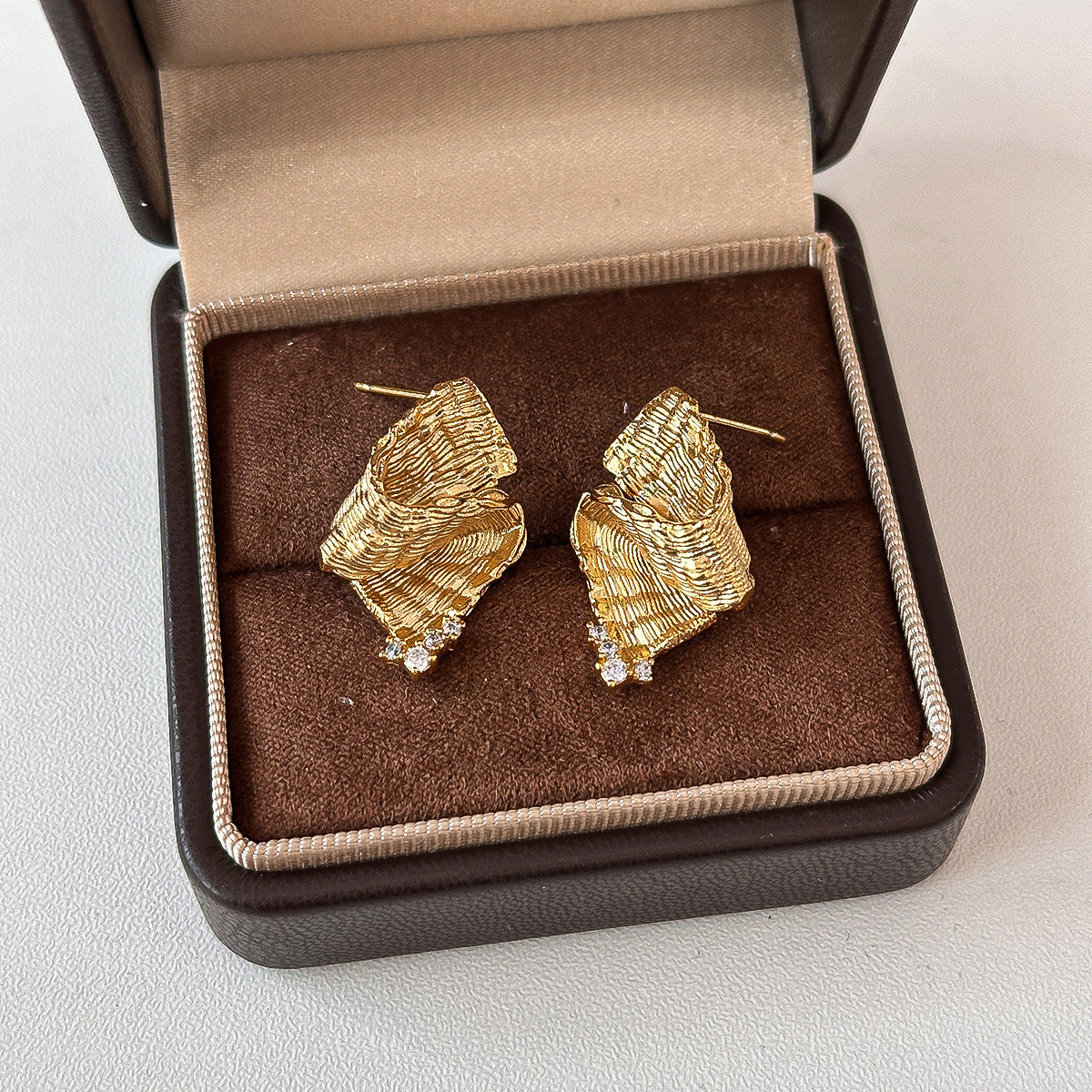 Light-luxury Plated Leaf Earrings With Irregular Diamond Inlay