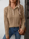 Tan cable-knit hooded sweater featuring a three-button placket and long sleeves on a model.