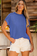 A chic blue minimalist knit t-shirt with short sleeves and a round neckline for women.