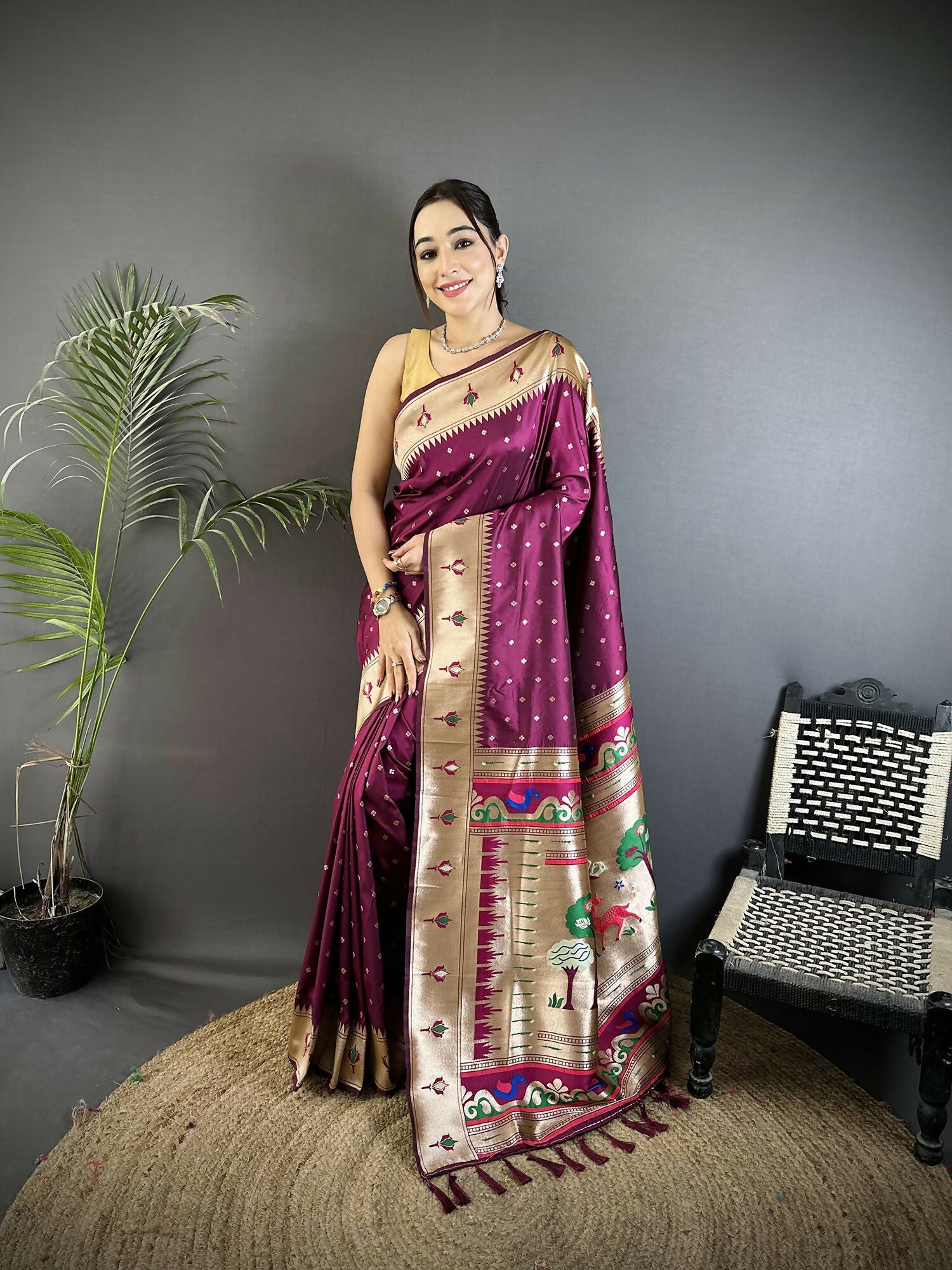 Wine-colored Soft Lichi Silk Kanchipuram saree with gold peacock and floral patterns