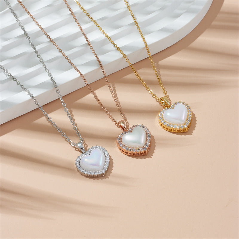 Heart-shaped shell pendant on an O-type chain, available in gold, silver, and rose gold finish.
