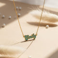 Personalized cursive name necklace available in gold, teal, pink, and magenta finish