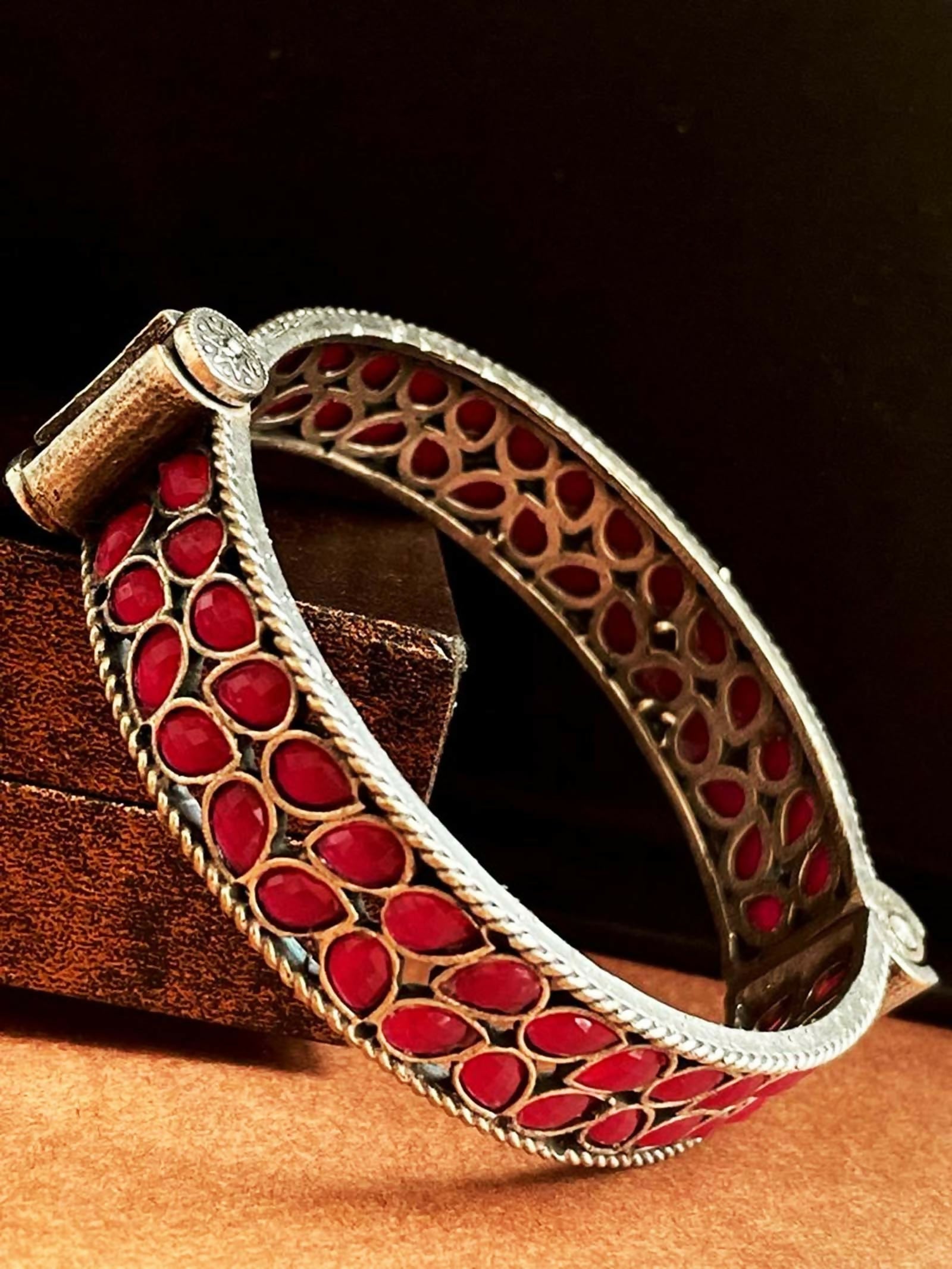 Red Brass Oxidized Ethnic Openable Kada with intricate detailing on a neutral background