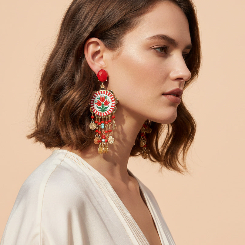 Vera Lux tulip-print waterfall tassel earrings with seed bead details on a white background.