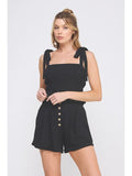 Black soft linen tank top with smocked detailing and adjustable tie straps