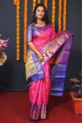 Pink Kanjivaram silk saree with Zari woven pattern and contrast blue blouse