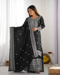 Elegant black silk kurta set with intricate sequins, zari, and thread embroidery for formal wear.