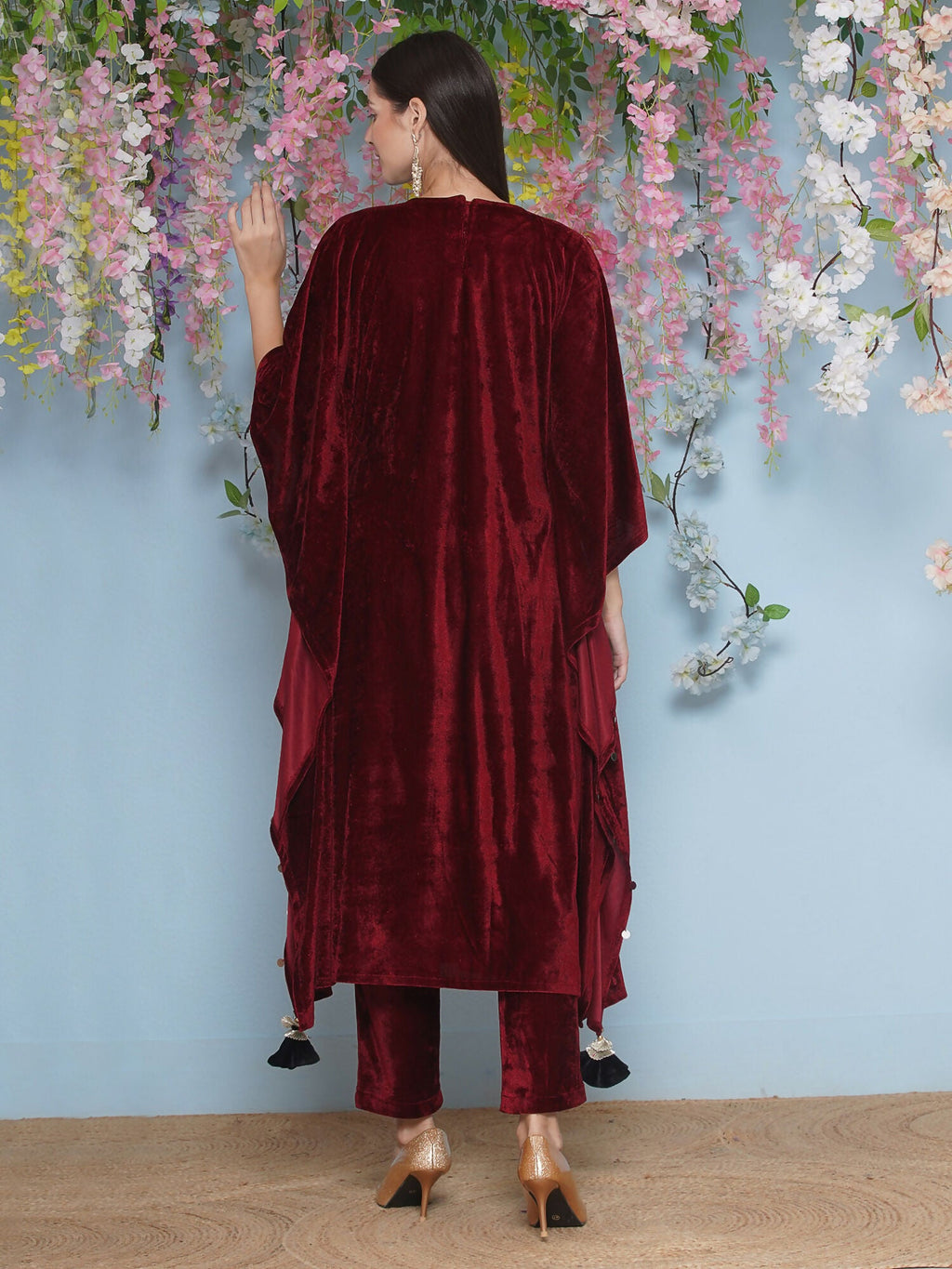 Luxurious maroon velvet kaftaan set with intricate hand-embellished details.