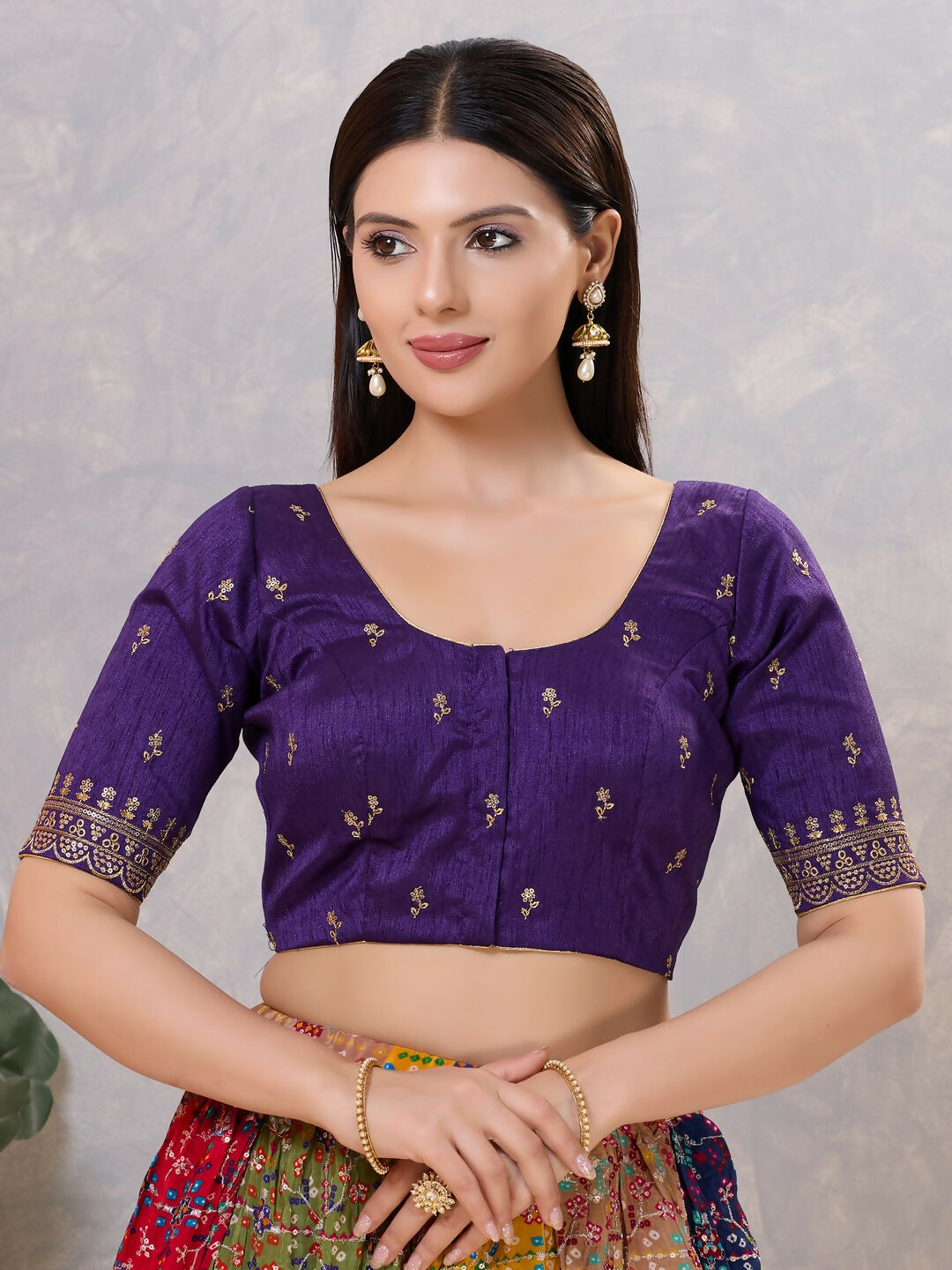 Elegant Brinjal silk stitched blouse with a classic round neck design.