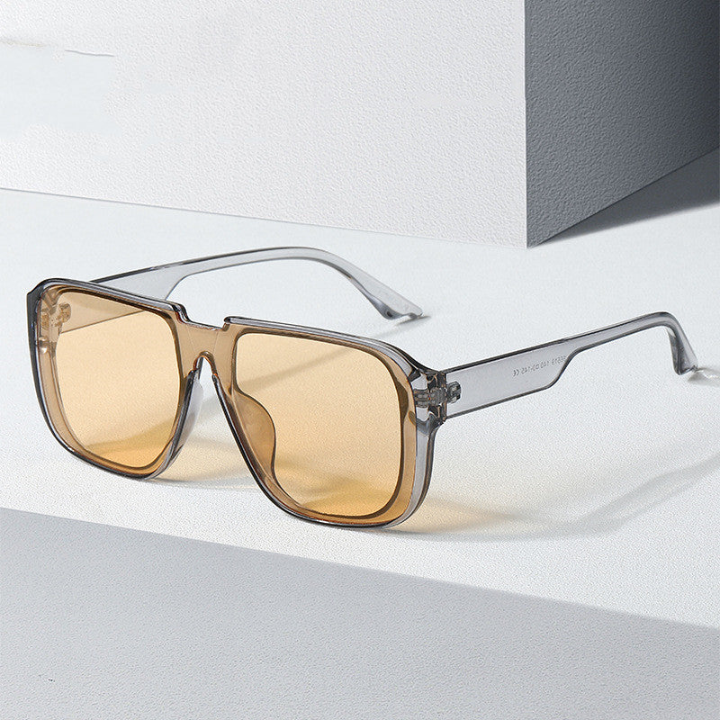 Lightweight unisex round retro sports sunglasses in translucent grey, amber, green, and black.