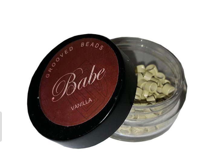 100 pieces of grooved beads in vanilla color stored in a clear container