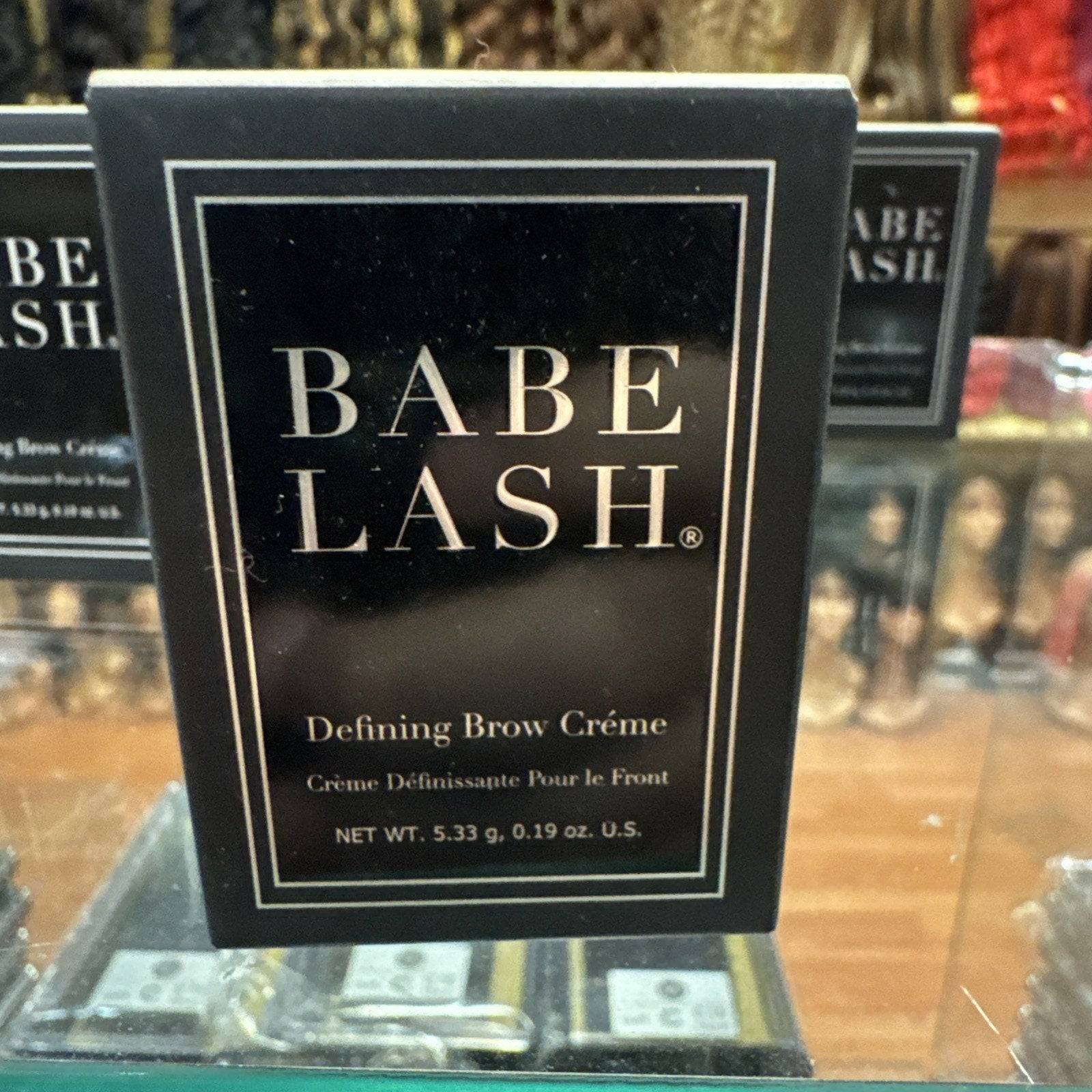 Babe Lash Defining Brow Creme container in Dark Brown