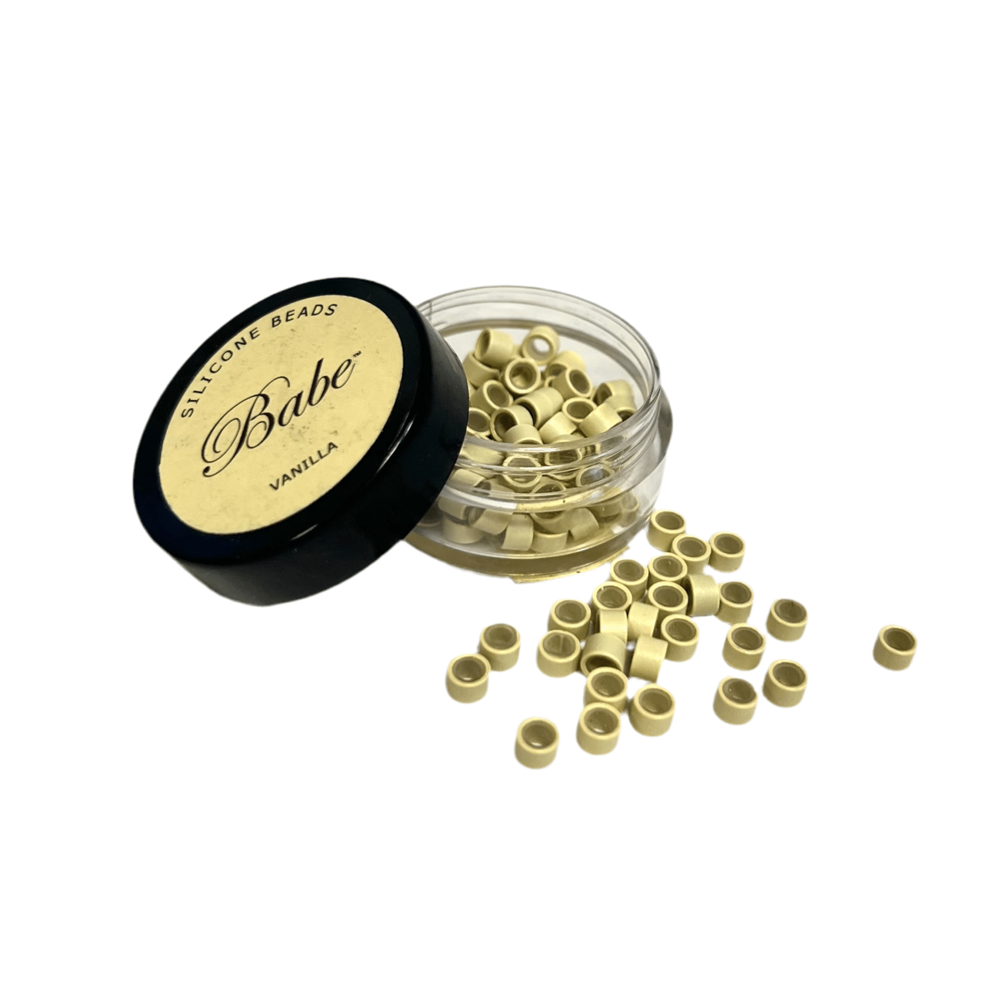 Close up of 4.0 mm silicone-lined copper rings for hair extensions in a professional container