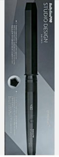 Professional black Studio Design CrimpCurl styling tool with 1/2 inch barrel on a modern bathroom counter