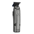 Gunmetal and black FXONE LO-PROFX professional trimmer with charging base.