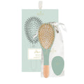 Bachca 3-piece hair care kit in light green featuring a detangling brush, mirror, and cotton pouch.
