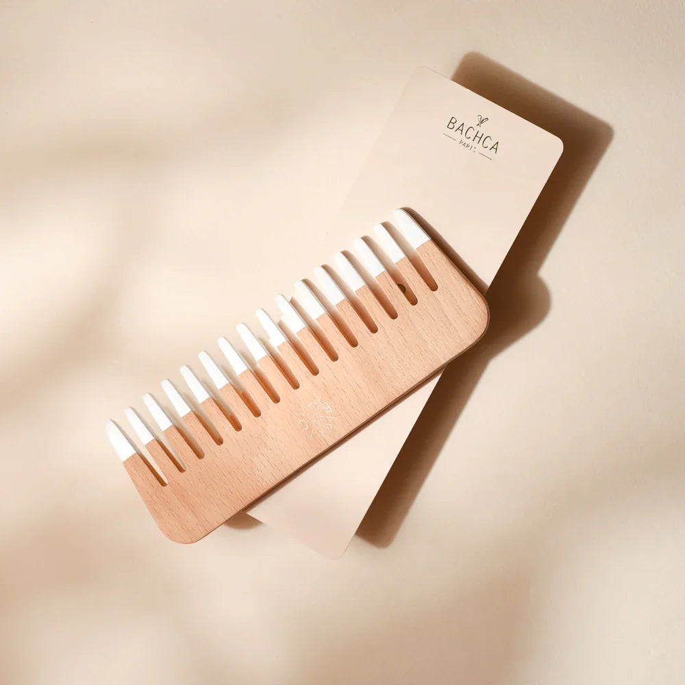 Minimalist wooden hair comb with natural wood finish and white dipped tips