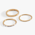 Alex And Ani set of three stacking rings featuring a faceted band, a clear baguette crystal band, and a smooth square band.