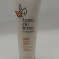 White and orange bottle of Bain de Terre Coconut Papaya Ultra Hydrating Treatment Balm 8.45 fl oz