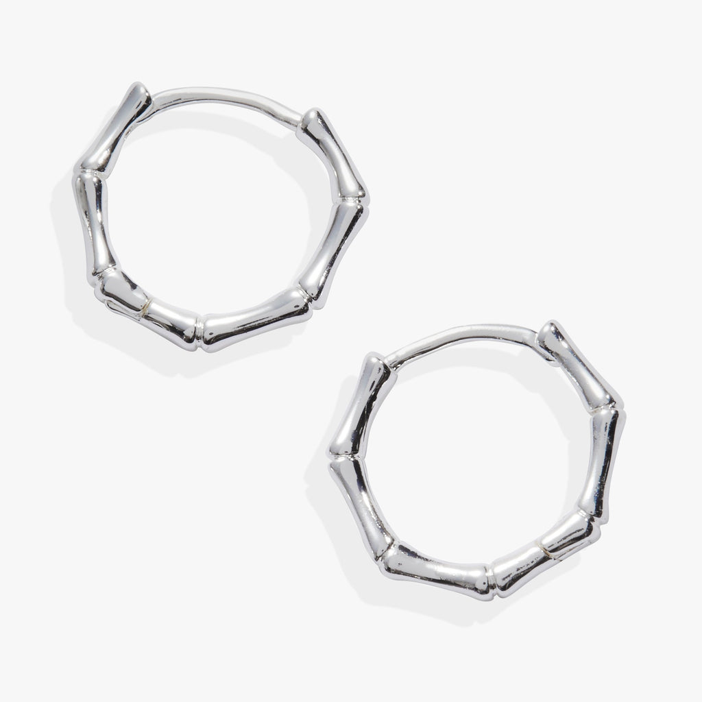A pair of gold-toned Bamboo Huggie Hoop earrings featuring sculptural bamboo-inspired textures and small faceted crystals.