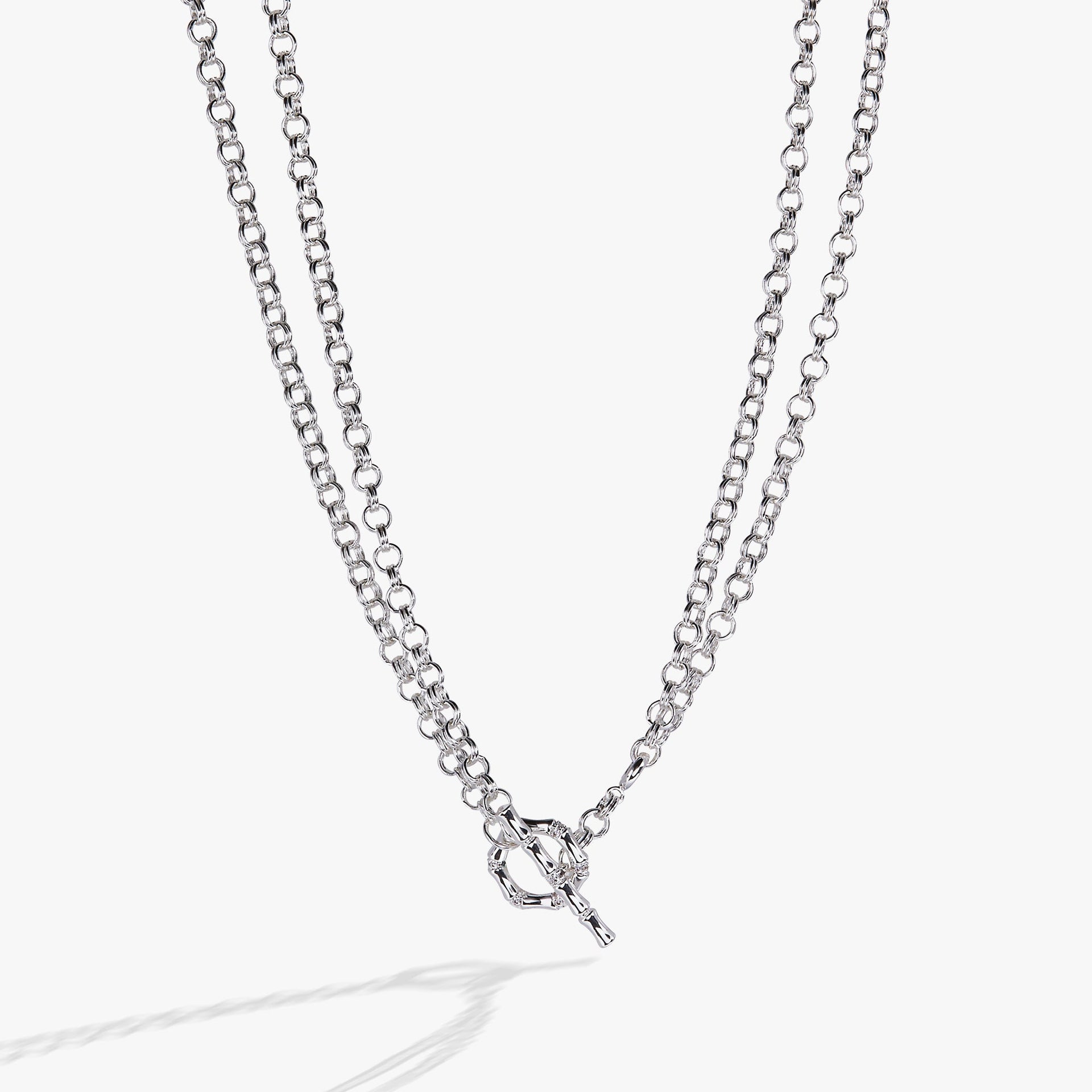 Convertible gold and silver bamboo-themed necklace and bracelet with pave crystals