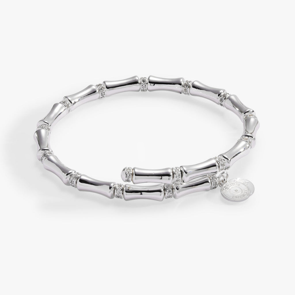 Elegant wrap bracelet featuring bamboo-textured links with sparkling pave crystal spacers.