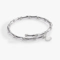 Elegant wrap bracelet featuring bamboo-textured links with sparkling pave crystal spacers.