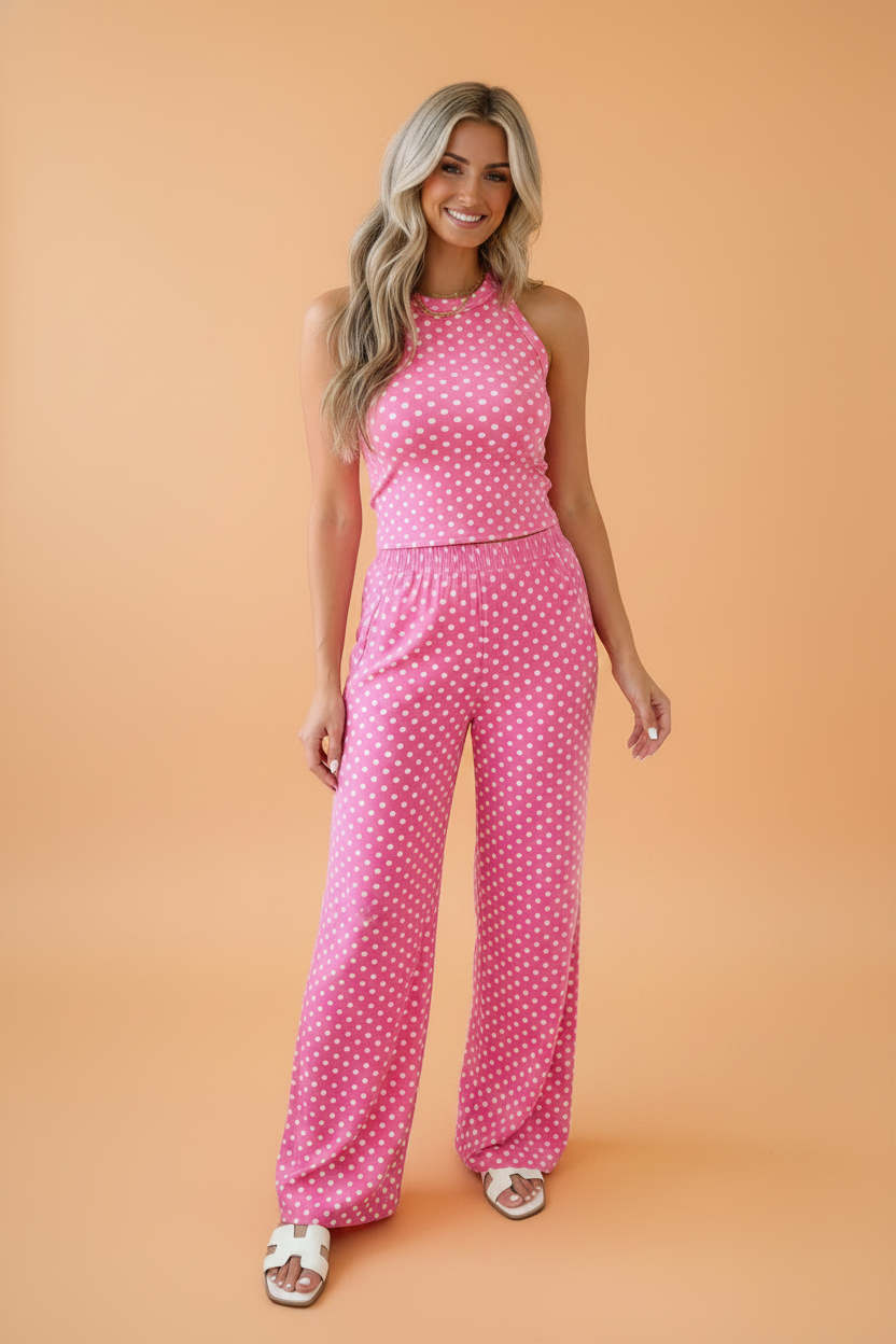 Woman wearing a stylish polka dot tank and flare pants matching set