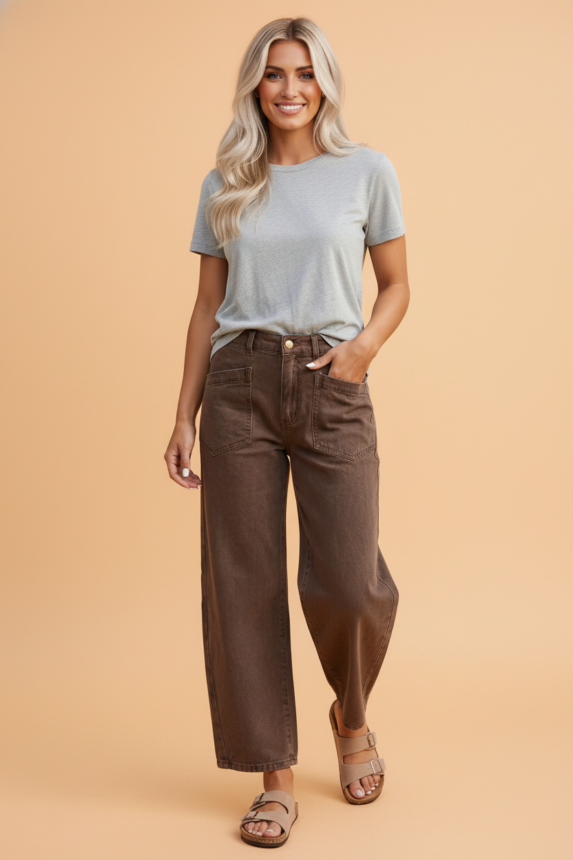Model wearing Solid Denim Patch Pocket Barrel Leg Jeans with a relaxed fit and square back pockets.
