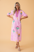 A stylish midi dress featuring vibrant floral bust prints and colorblock trim with a V-neckline.