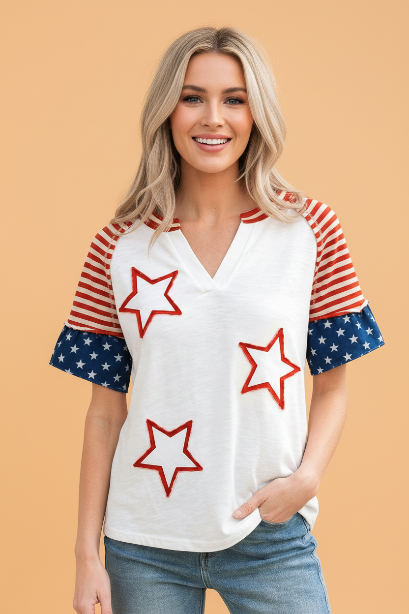 Woman wearing a USA flag star patchwork raglan sleeve V-neck top in white, red, and blue
