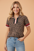 A colorful leopard and stripe patchwork blouse with a half-zip collared neckline and relaxed fit.