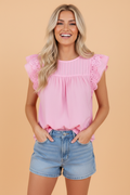 Pink solid blouse with flutter sleeves, intricate pintuck pleats, and floral lace trim.