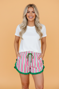 Close up of stripe contrast ruffle trim drawstring shorts in pink, green, and white