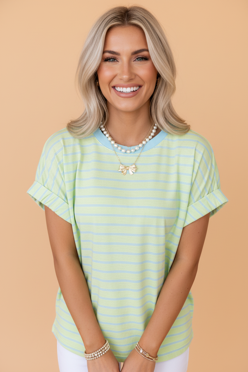 Model wearing a classic horizontal stripe short sleeve t-shirt with a round neckline and rolled cuffs.