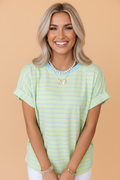 Model wearing a classic horizontal stripe short sleeve t-shirt with a round neckline and rolled cuffs.
