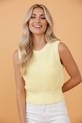 Yellow cropped knit tank top with tie back and cutout detail