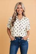 Polka dot buttoned shirt with dolman sleeves and rolled cuffs in cream and black
