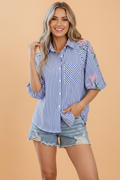 Striped button-down shirt with floral lily embroidery and puff sleeves