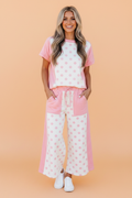 Pink and white polka dot colorblock top and matching wide leg pants set