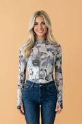 Close up of a romantic floral mesh long sleeve high neck sheath top in grey