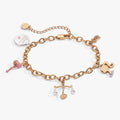 Barbie Legal Charm Bracelet featuring pink enamel charms on gold and silver tone chain