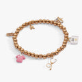 Barbie medical themed stretch bracelet with a pavé B logo and a pink enamel scrub charm.