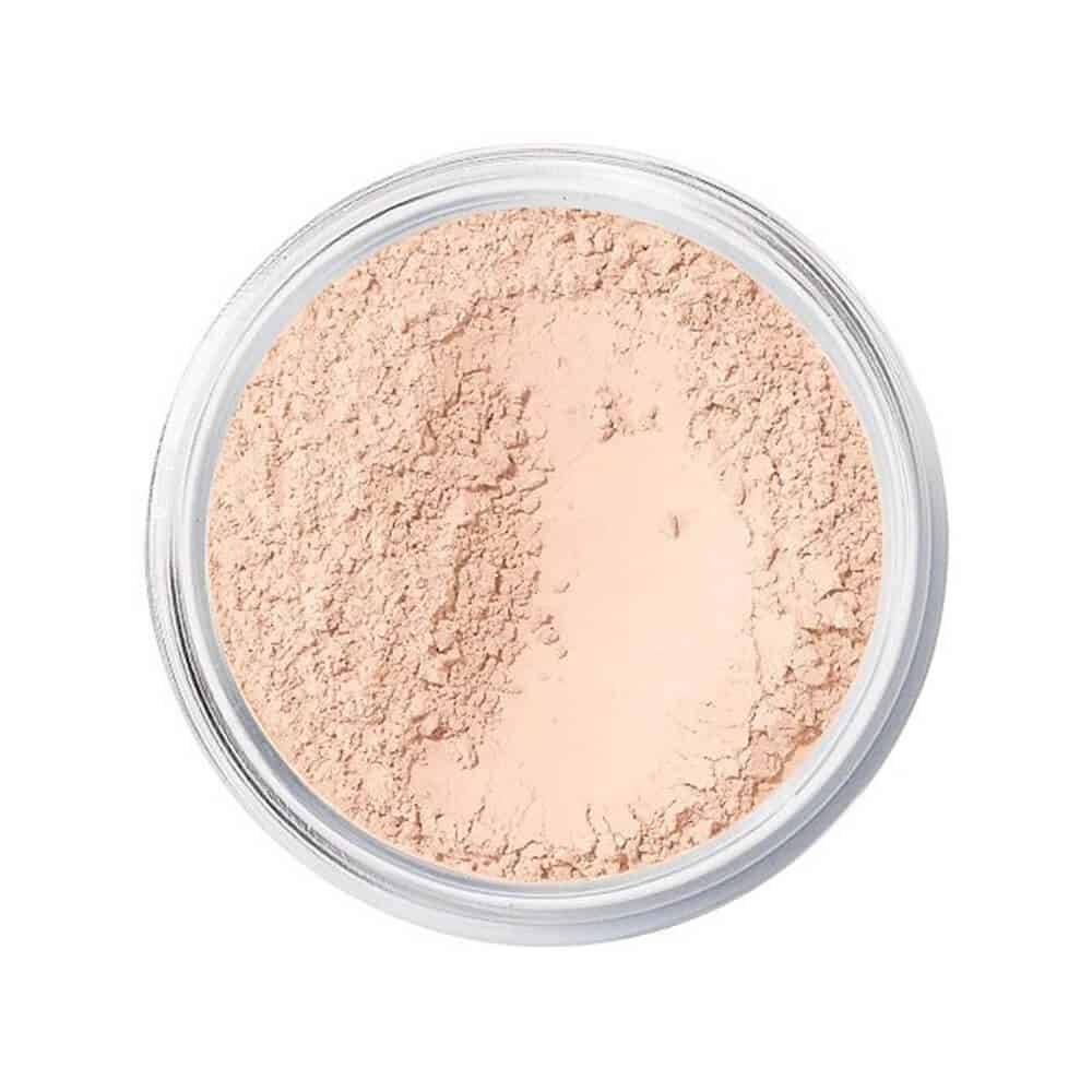 Close up of beige Mineral Veil Finishing Powder in a jar with SPF 25 label