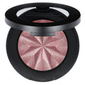 Close-up of GEN NUDE® Highlighting Blush powder in a compact, showing a silky, pearlescent finish for a radiant complexion.
