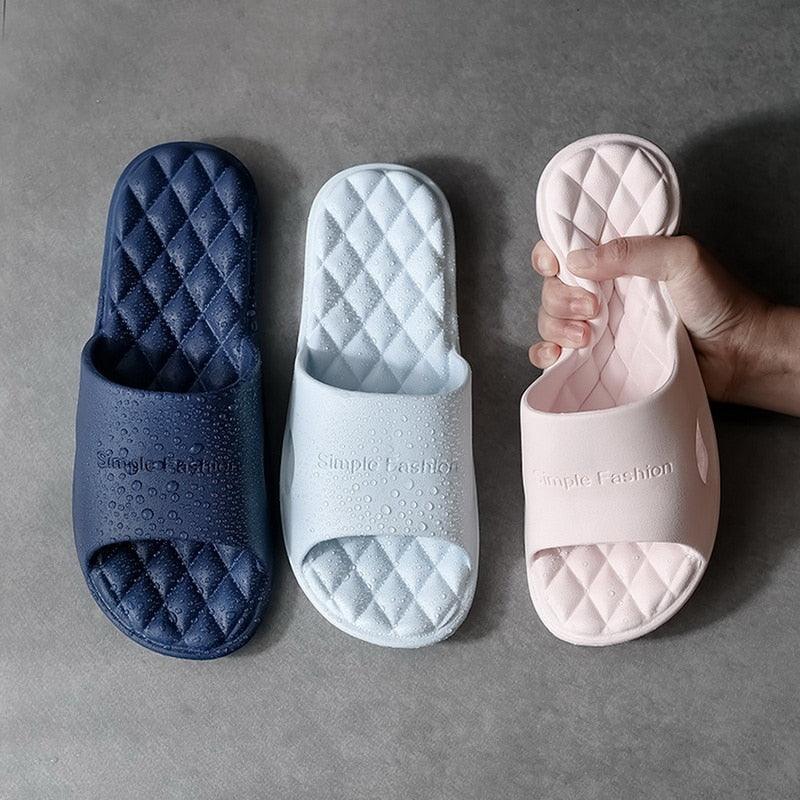 Women's minimalist geometric cloud shower slides in navy, light blue, and pale pink