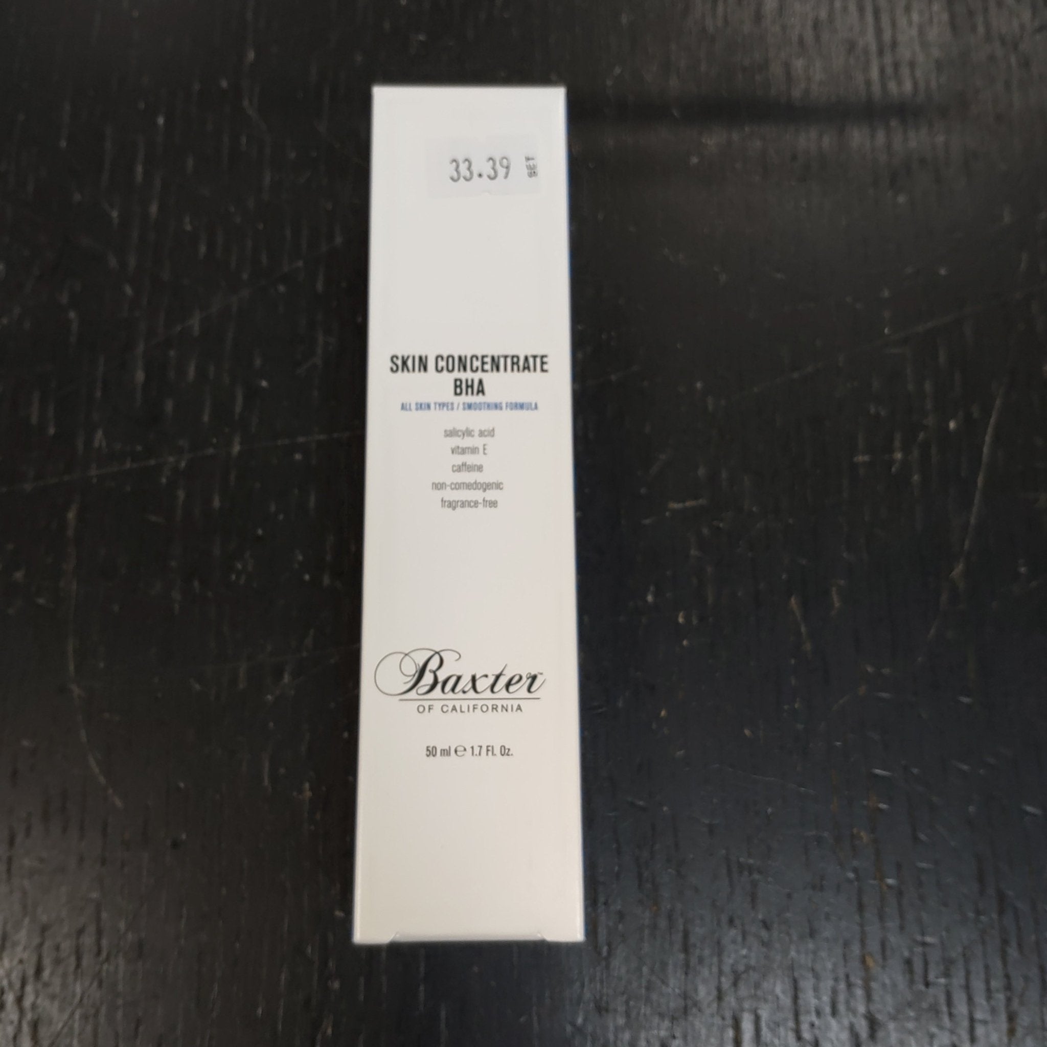 Baxter of California Skin Concentrate BHA bottle in minimalist white and black packaging.
