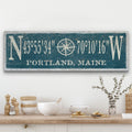 Personalized canvas sign featuring a distressed compass rose and custom GPS coordinates
